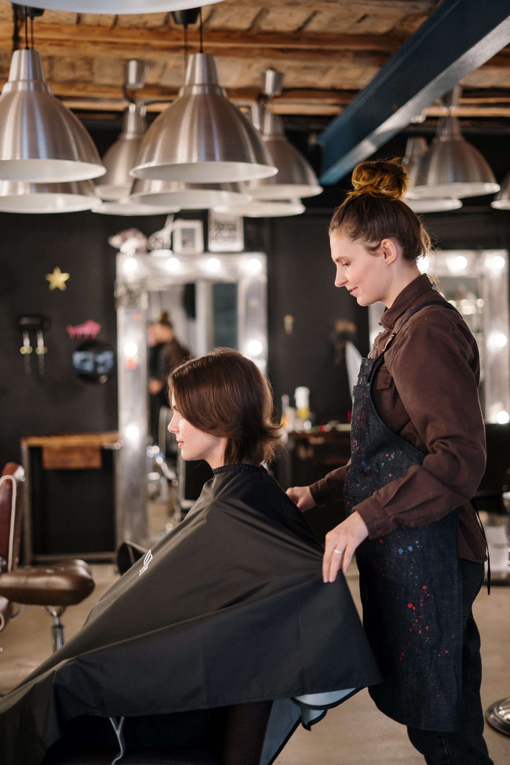 woman getting hair cut in salon