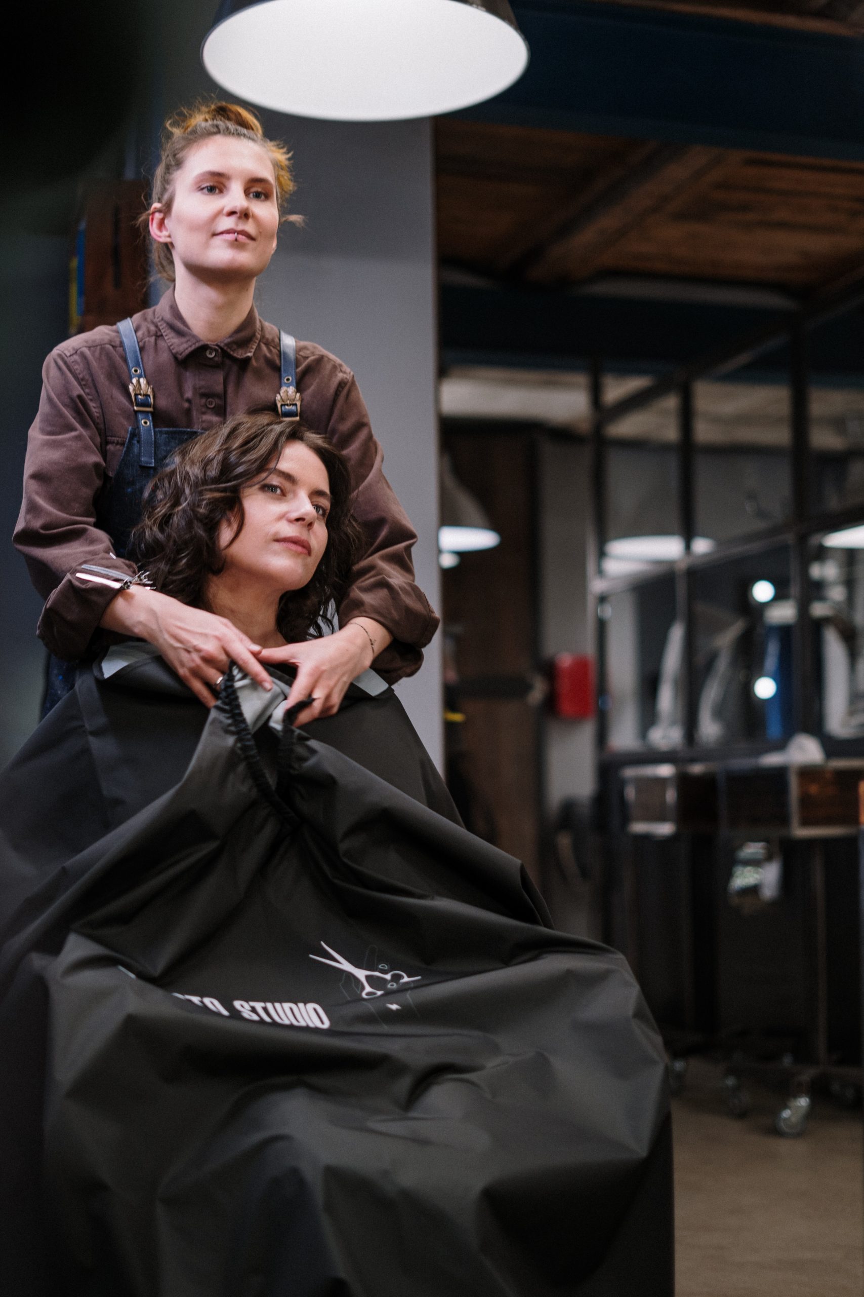 woman in salon getting hair cut